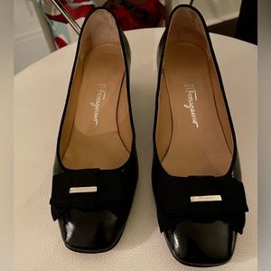 Never worn Salvatore Ferragamo black patent pumps.